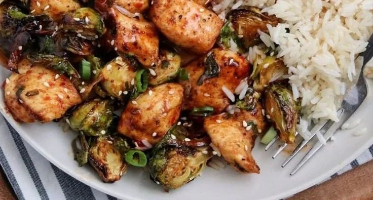 Crispy air fried chicken breast served with Brussels sprouts on a plate