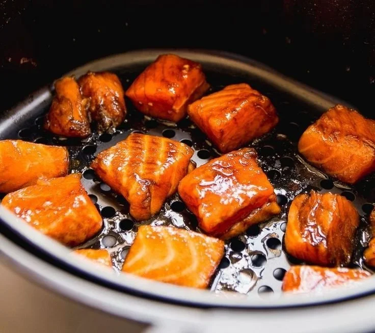 Air Fried Teriyaki Salmon Bites served on a plate with garnish
