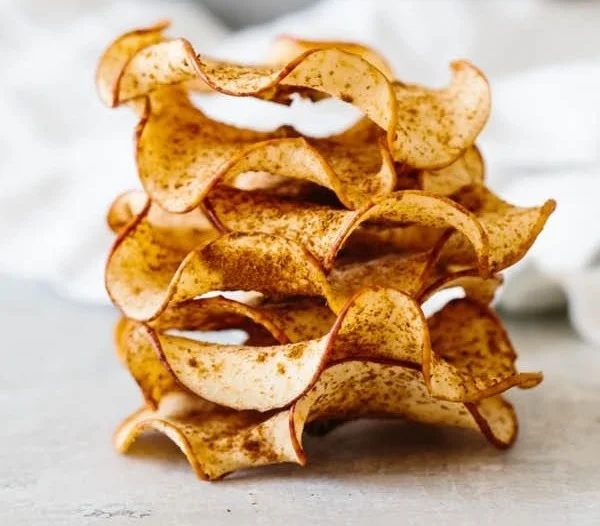 Crispy baked apple chips, a healthy snack alternative made from fresh apples.