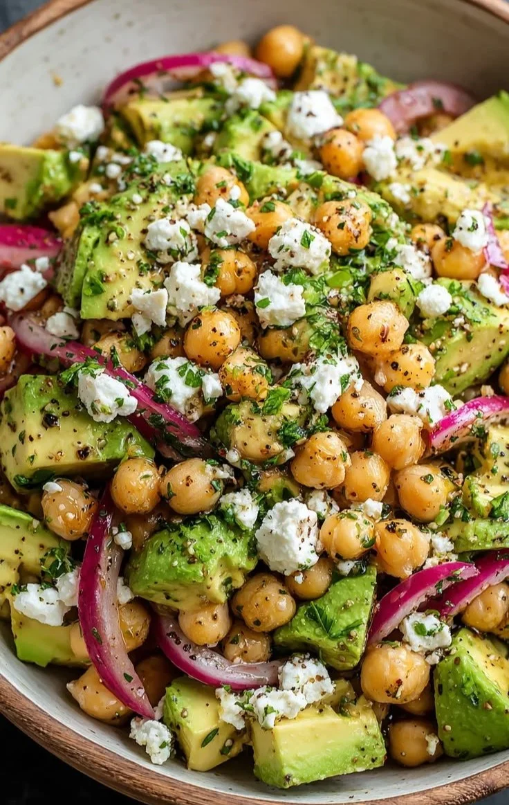 Chickpea Feta Avocado Salad with colorful vegetables and dressing