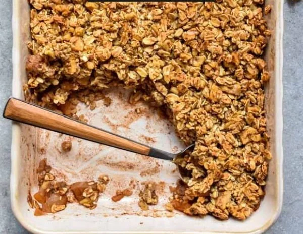 Cinnamon Apple Oatmeal Crumble served warm in a bowl.