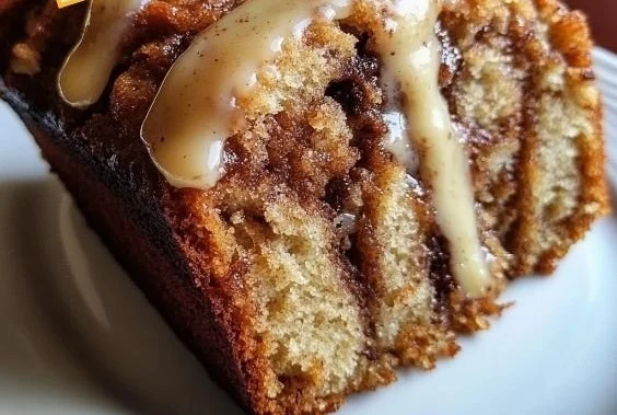 Delicious cinnamon roll banana bread with swirls of cinnamon and icing