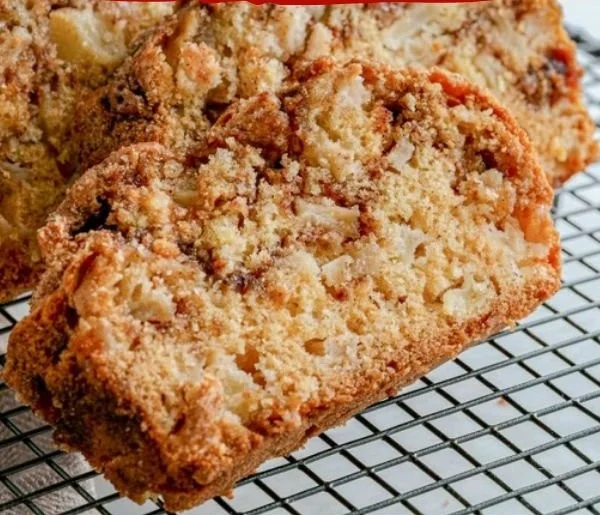 Deliciously baked cinnamon swirl apple bread with apple chunks and cinnamon swirls
