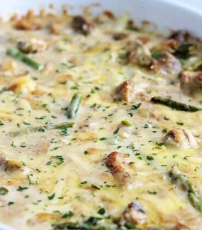 Creamy chicken bake with asparagus served in a casserole dish