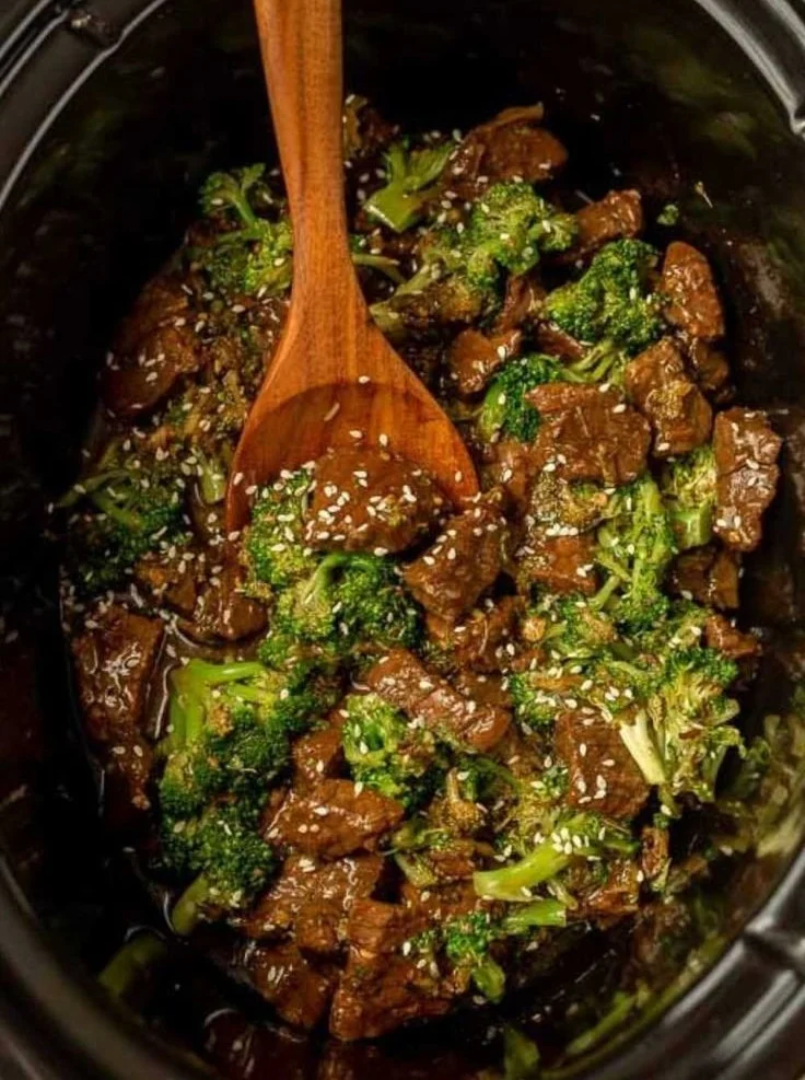 Crock Pot Beef and Broccoli served in a bowl with rice and vegetables