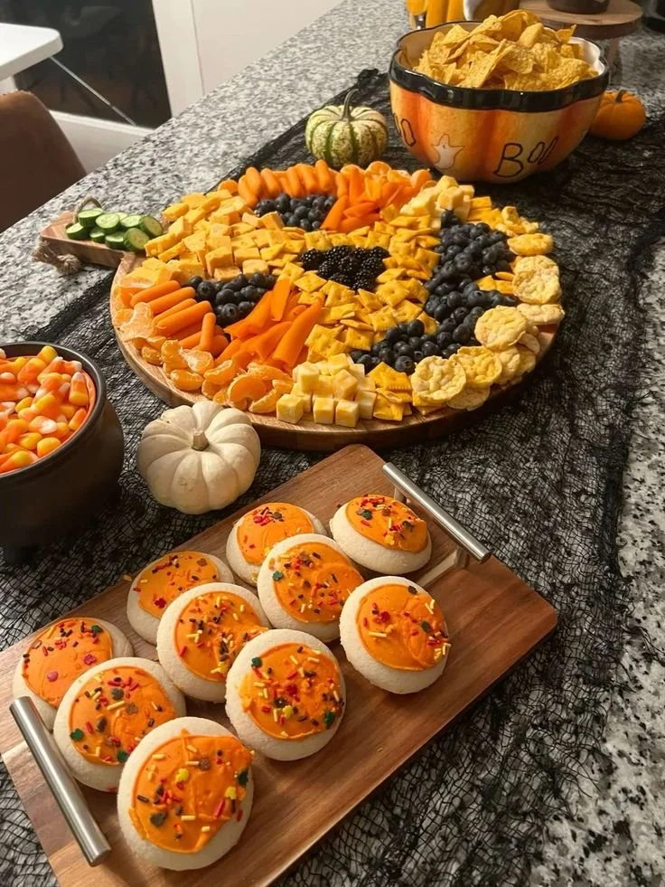A variety of easy Halloween snacks for kids displayed on a festive table.