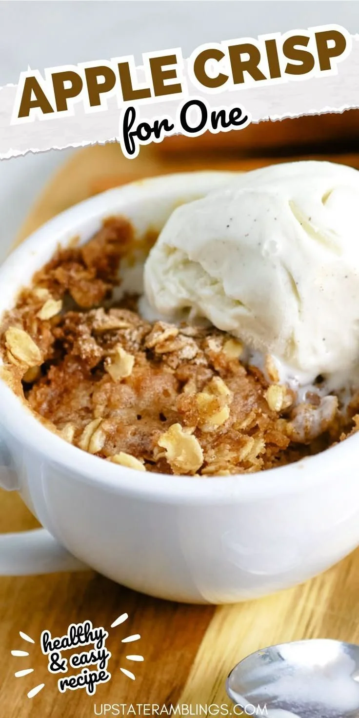 Healthy microwave apple crisp served in a bowl with cinnamon and oats.