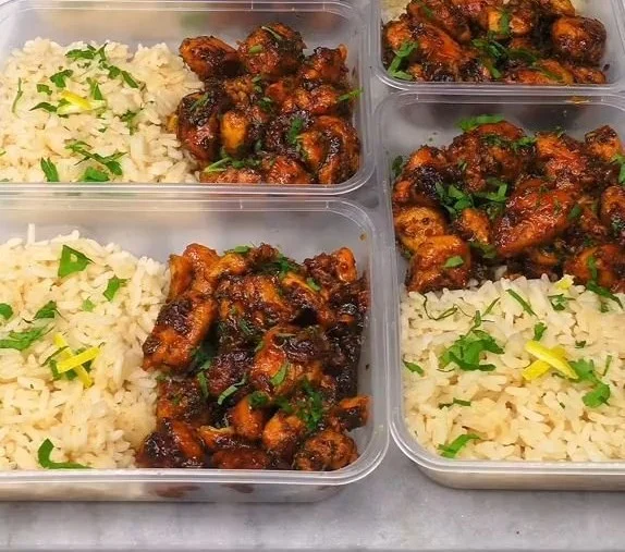 Delicious high protein honey lemon chicken dish garnished with fresh herbs.