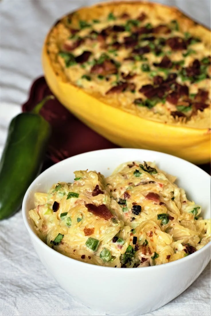 Delicious jalapeño popper spaghetti squash topped with cheese and jalapeños