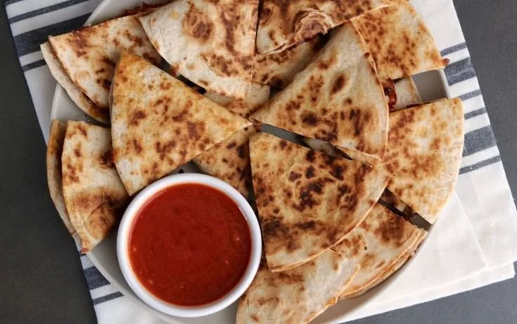 Delicious pizza quesadilla with melted cheese and toppings