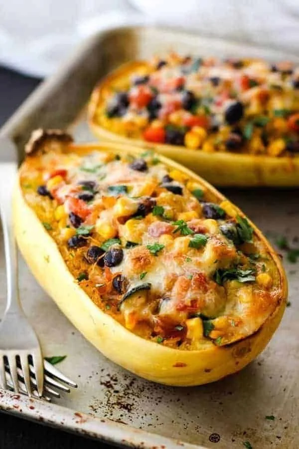 Spaghetti Squash Burrito Bowl with toppings served in a bowl for two