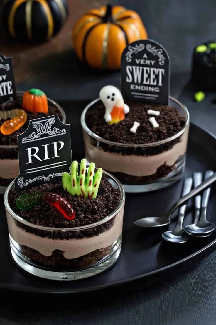 Spooky Halloween Brownie Dirt Pudding dessert with oreos and Halloween decorations