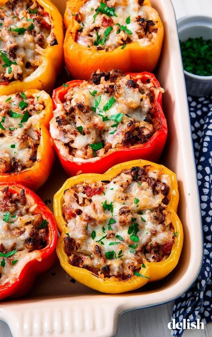 Colorful stuffed peppers filled with a flavorful mixture of vegetables and grains.