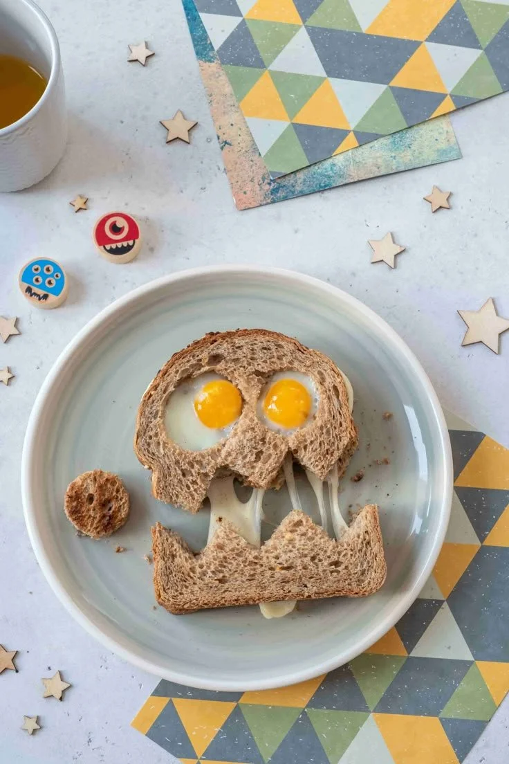 A variety of healthy Halloween treats including fruits and veggie snacks