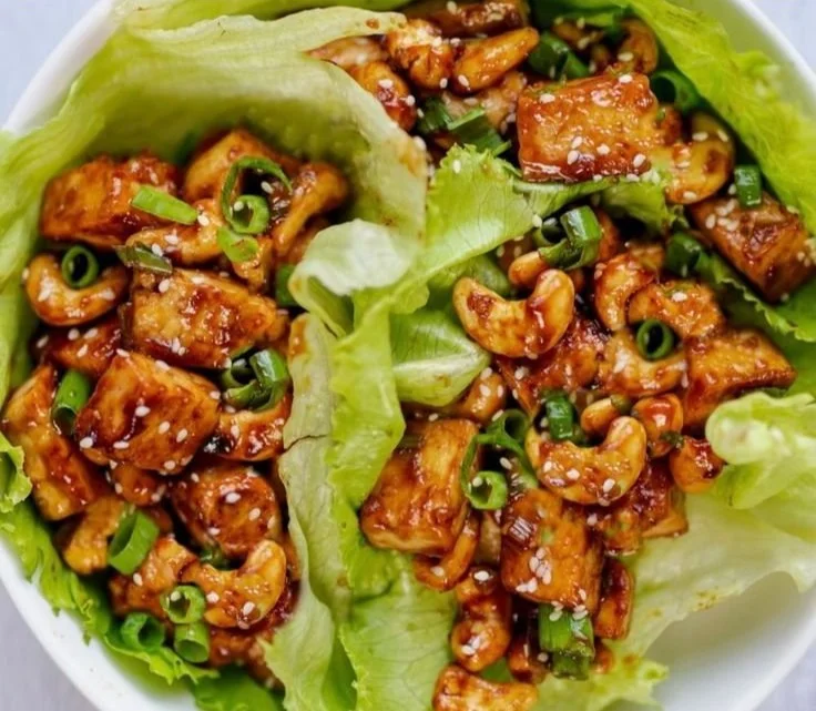 Delicious tofu lettuce wraps with fresh vegetables and a savory sauce
