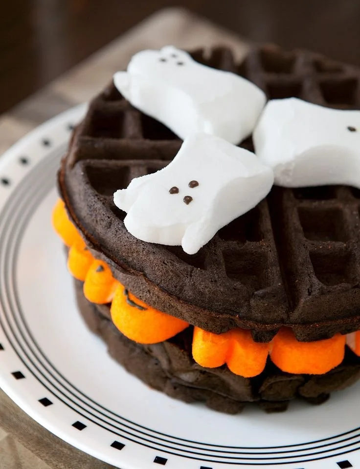 Dark chocolate marshmallow Halloween waffles on a festive plate