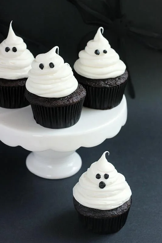Delicious Halloween ghost cupcakes with white frosting for spooky celebrations