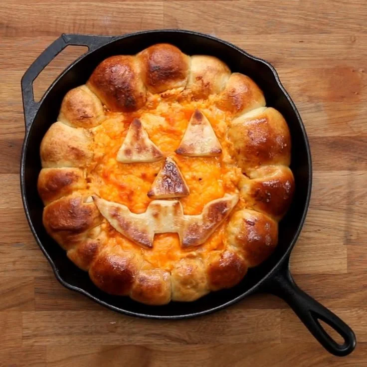 Halloween buffalo chicken skillet dip in a festive serving dish