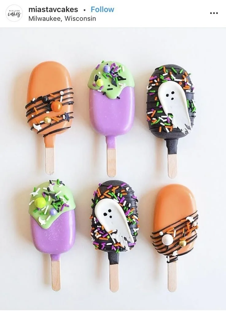 Colorful Halloween themed cakesicles perfect for spooky celebrations.