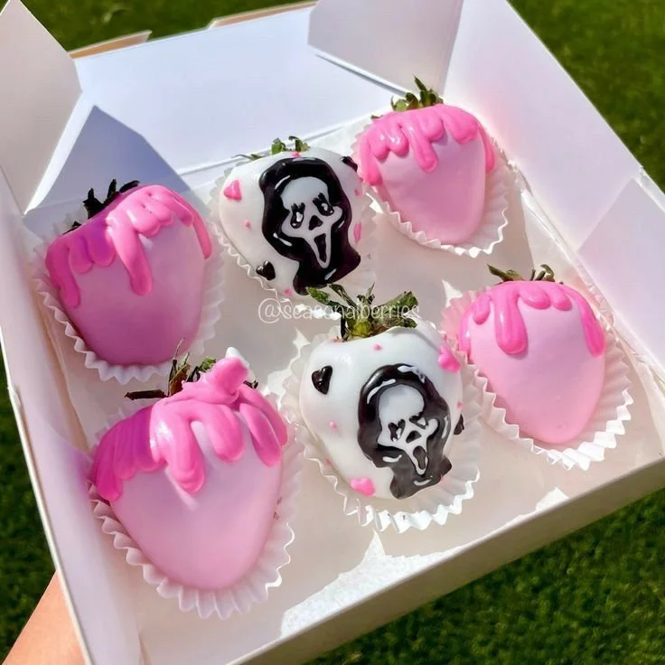 Halloween chocolate covered strawberries decorated for spooky celebrations