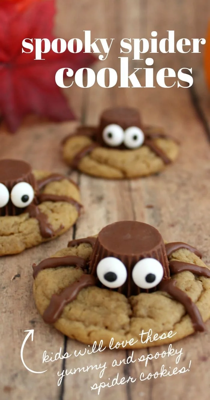 Spooky Halloween spider cookies decorated with icing and candy legs