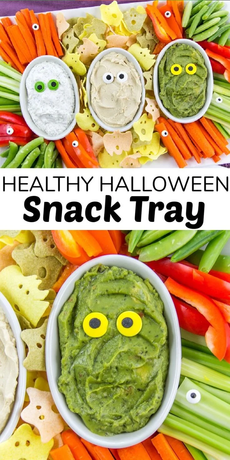Healthy Halloween snack food tray filled with colorful fruits and veggies