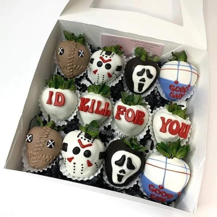 Fresh Ghostface strawberries inspired by horror icons, perfect for Halloween treats.