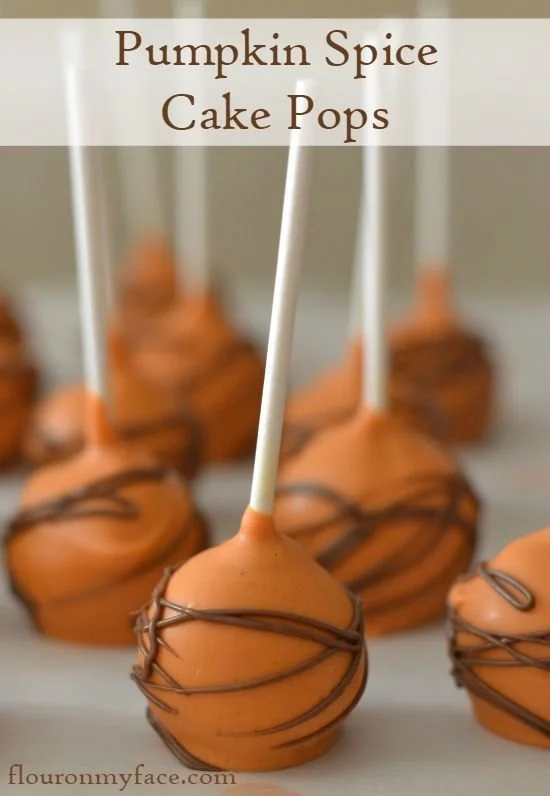Delicious pumpkin spice cake pops decorated for fall and Halloween celebrations.