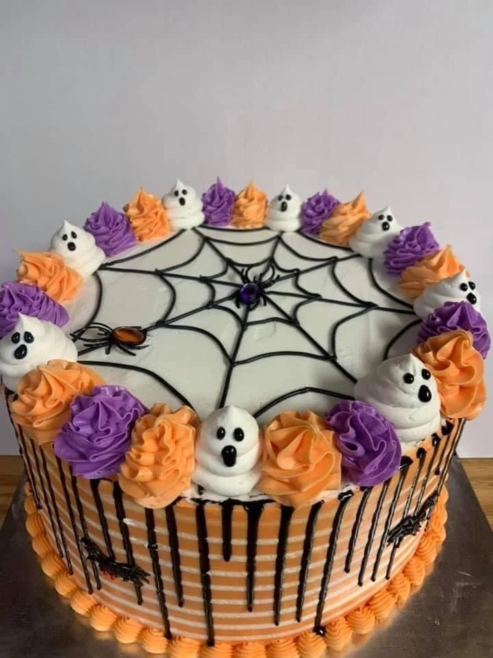 Spooky Halloween cake decorated with purple icing for Halloween celebrations.